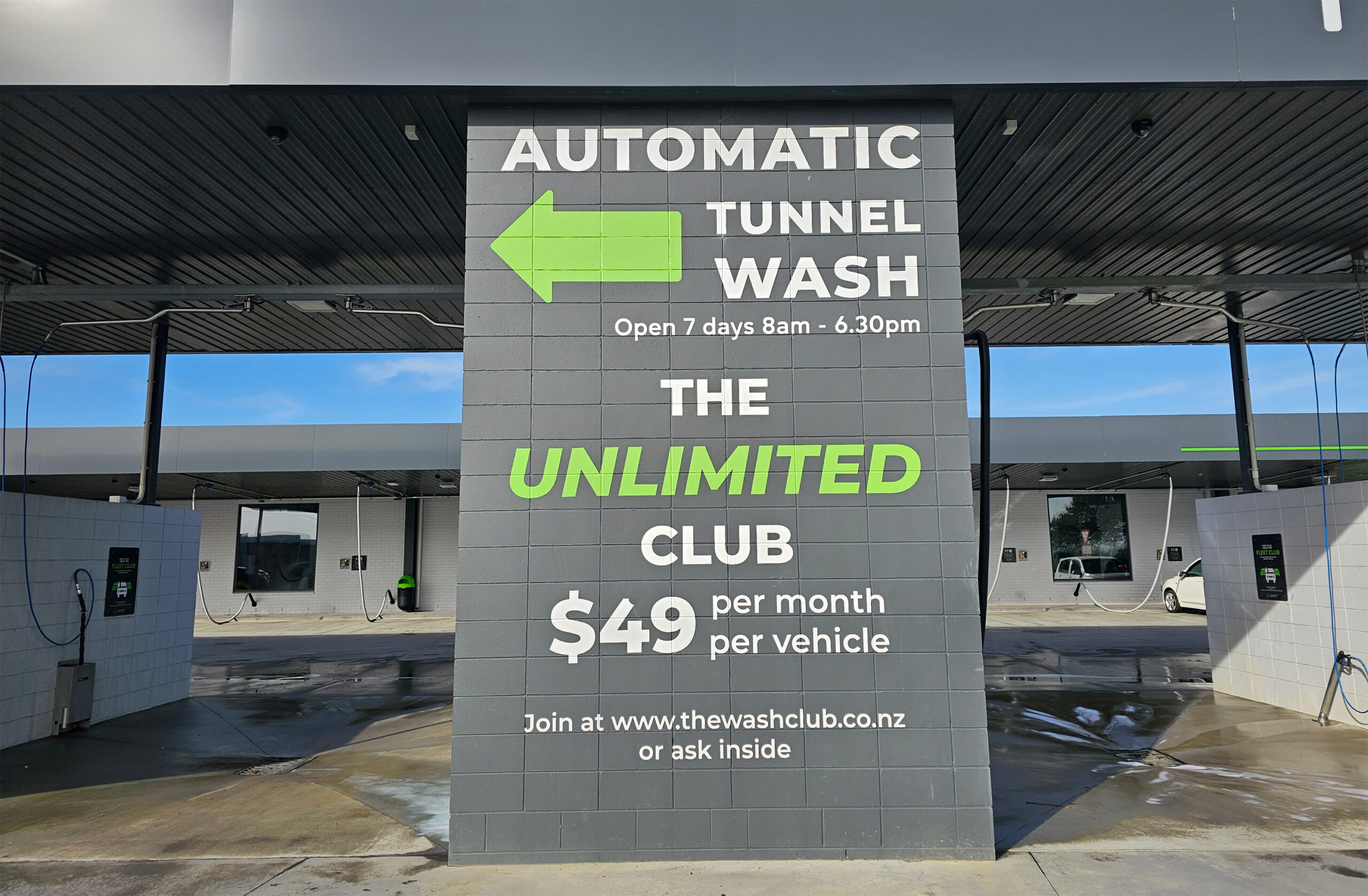 The Unlimited Club car wash wall sign
