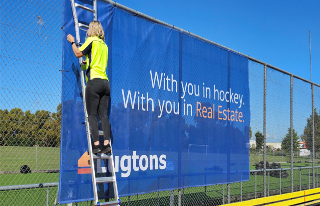 Promotional banner on fence for Lugtons